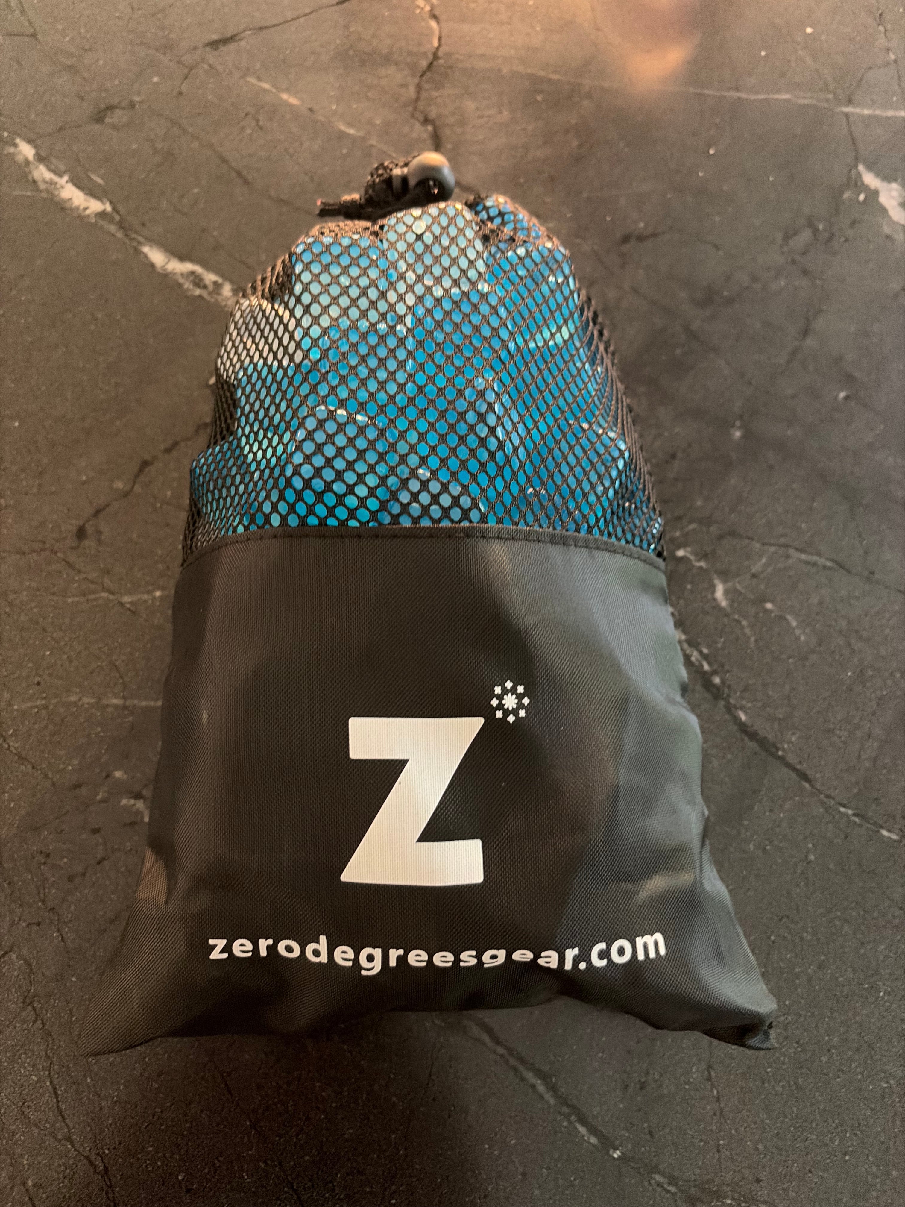 Black mesh drawstring bag of reusable ice cubes, designed to hold enough for one HERO™ Cooling Collar
